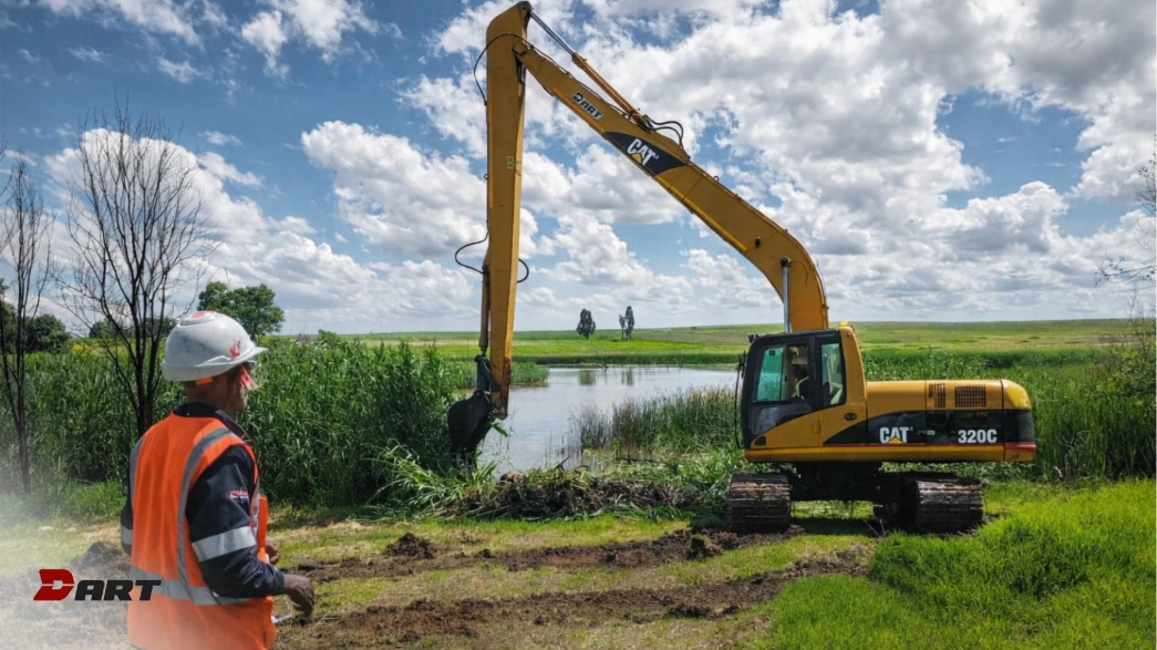 Long Reach Excavator clearing reeds