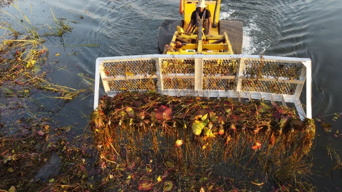 Water Dozer removing aquatic weeds