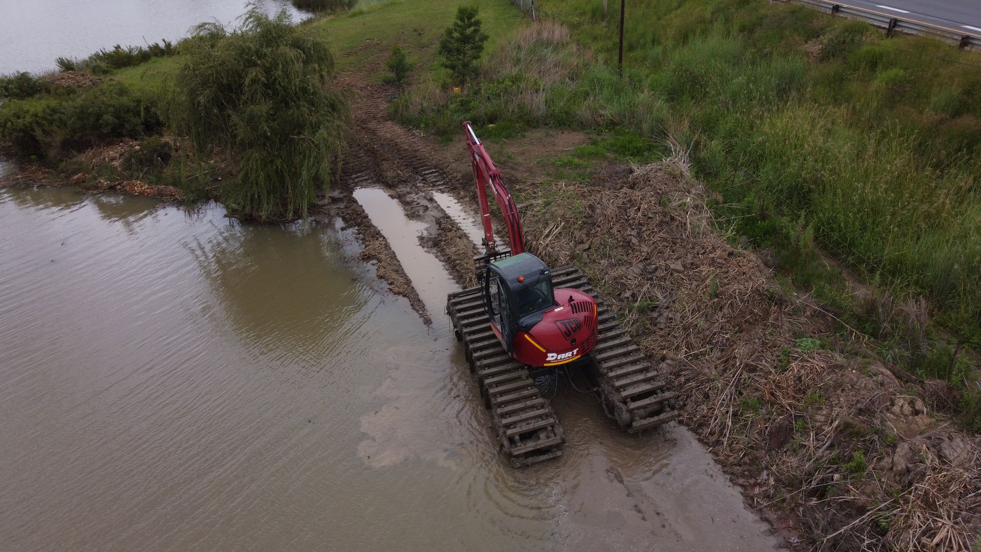 Amphibious Excavator clearing reeds